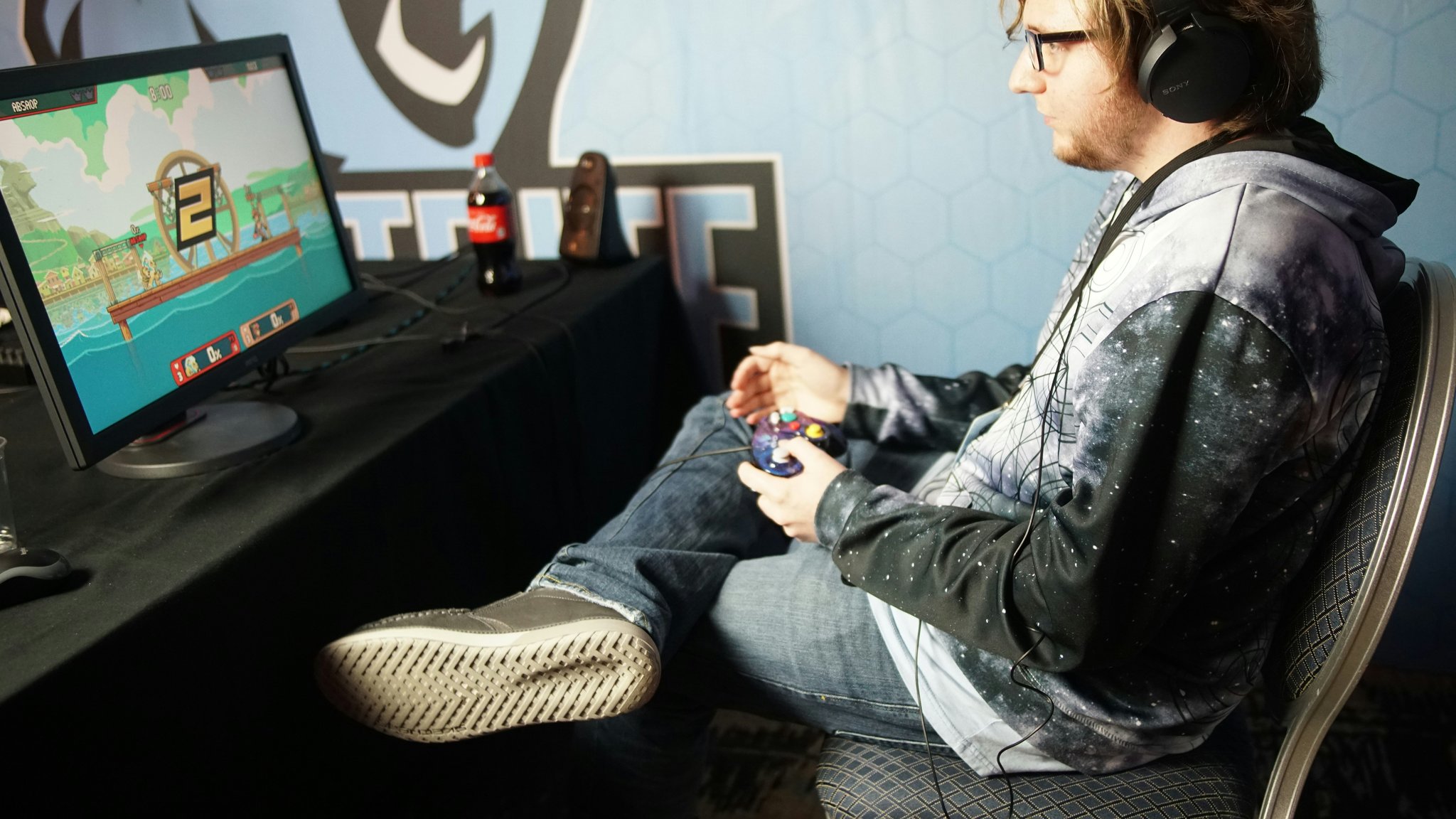 A happy gamer holding their optimized gaming tablet setup.