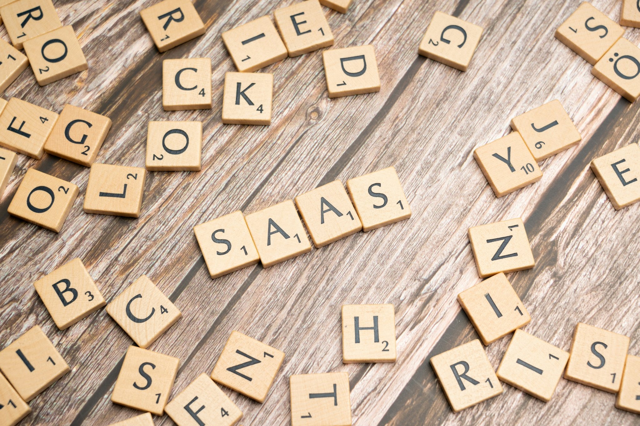 Photos of happy gamers celebrating victories over word games.