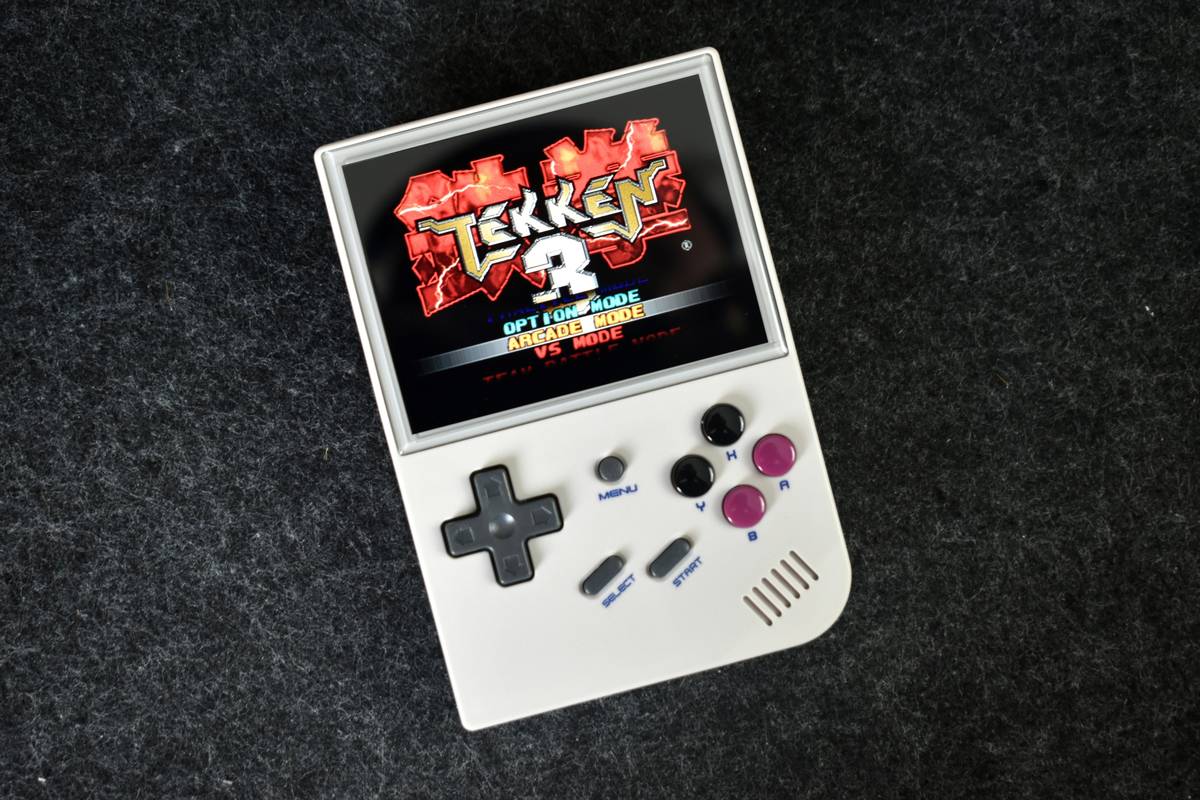 Gamer holding a tablet with vibrant fantasy game visuals on screen