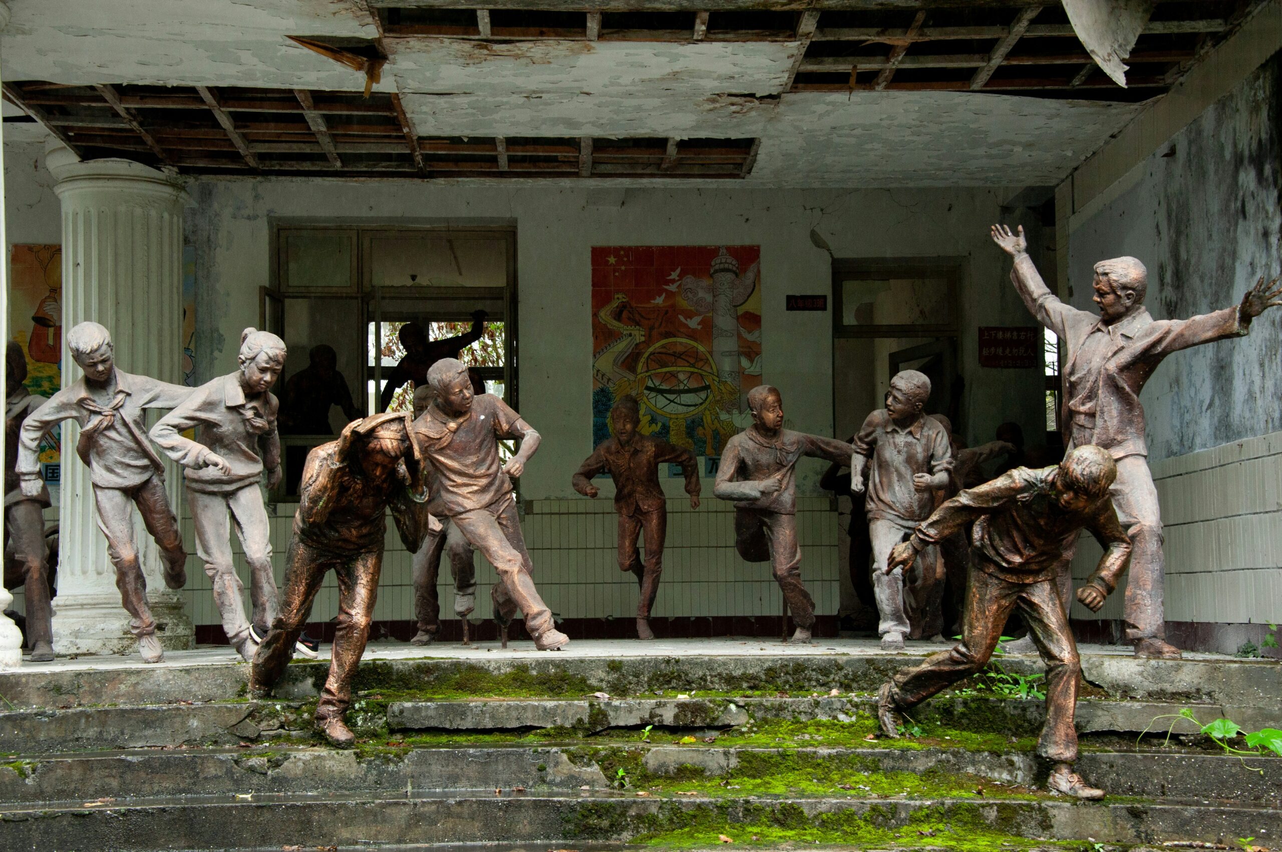 A group of statues of people standing on top of steps