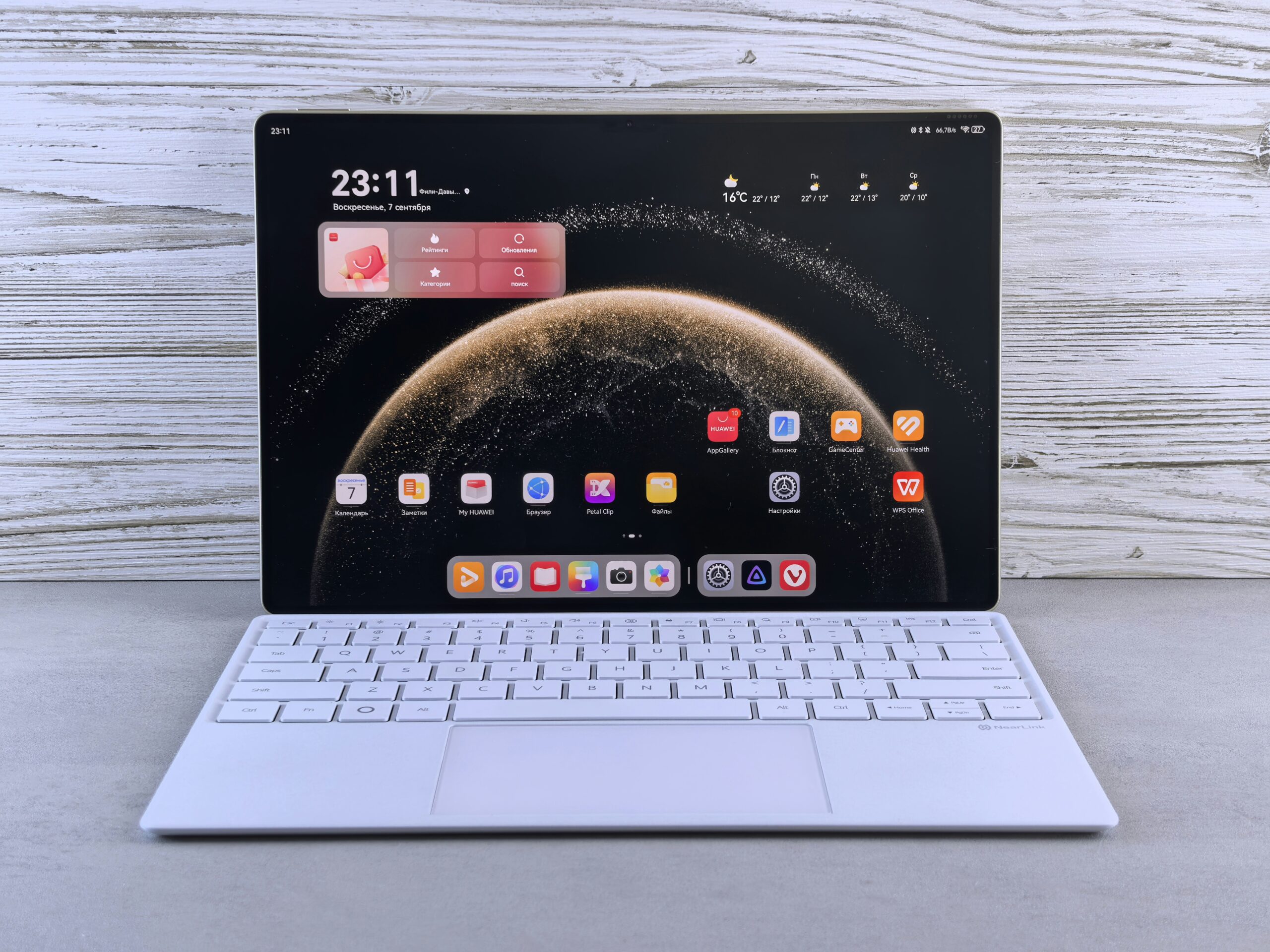 A modern tablet with a white keyboard attachment.